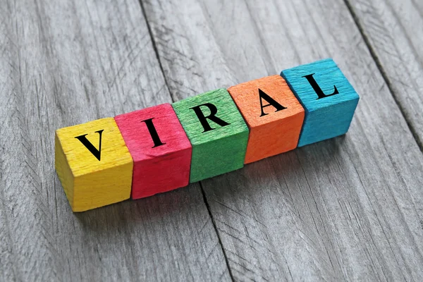 Word viral on colorful wooden cubes — Stock Photo, Image