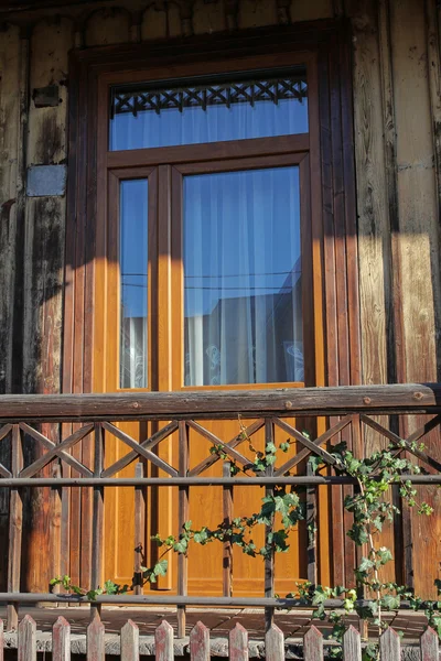 Balcony door of traditional wooden house — Stock Photo, Image