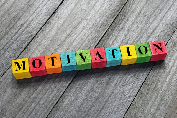 Motivation word on colorful wooden cubes — Stock Photo, Image