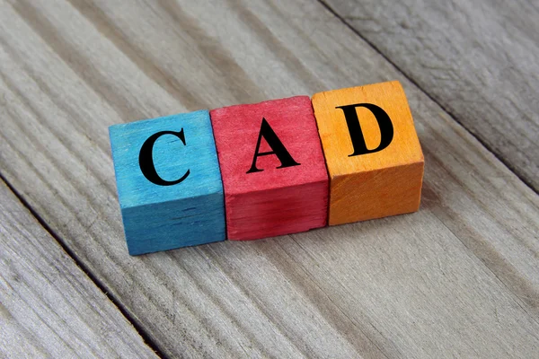 CAD (Canadian Dollar) sign on colorful wooden cubes — Stock Photo, Image