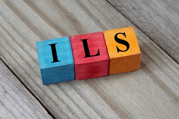 ILS (Israeli Shekel) sign on colorful wooden cubes — Stock Photo, Image