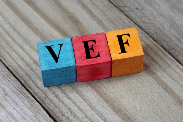 VEF (Venezuela Bolivar) tecken på färgglada trä kuber — Stockfoto