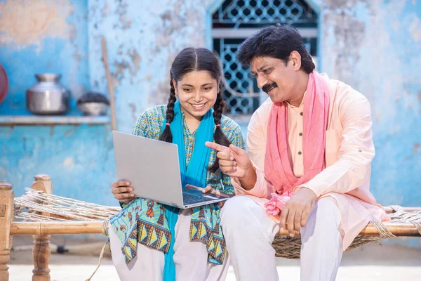 Happy Indian Father Young Daughter Using Laptop While Sitting Traditional Royalty Free Stock Images