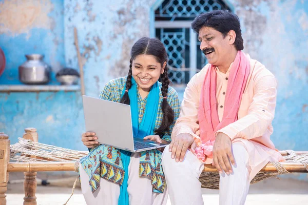 Pleasant Indian Father Young Daughter Using Laptop While Sitting Traditional Stock Image