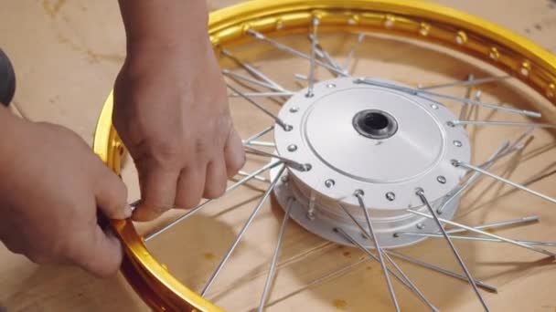 Technician Man Working Motorcycle Wheel Has Spokes Weave Mechanic New — Stock Video