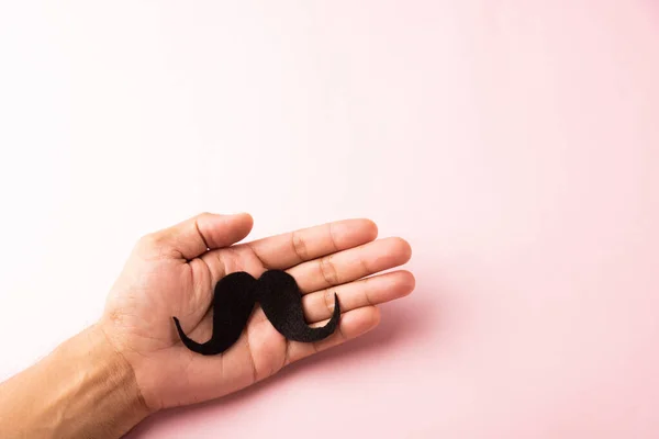 Homem Usa Mão Segurando Bigode Preto Estúdio Isolado Fundo Branco — Fotografia de Stock