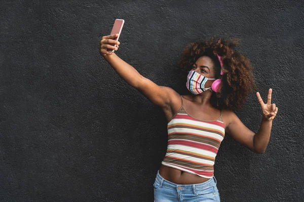 Happy Afro Woman Taking Selfie Mobile Smartphone While Wearing Face — Stock Photo, Image