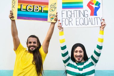 Happy drag queen activists protesting during gay pride parade - LGBT social movement concept clipart