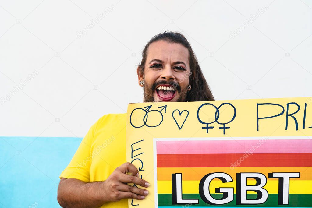 Happy drag queen activist having fun during gay pride parade - LGBT social movement concept