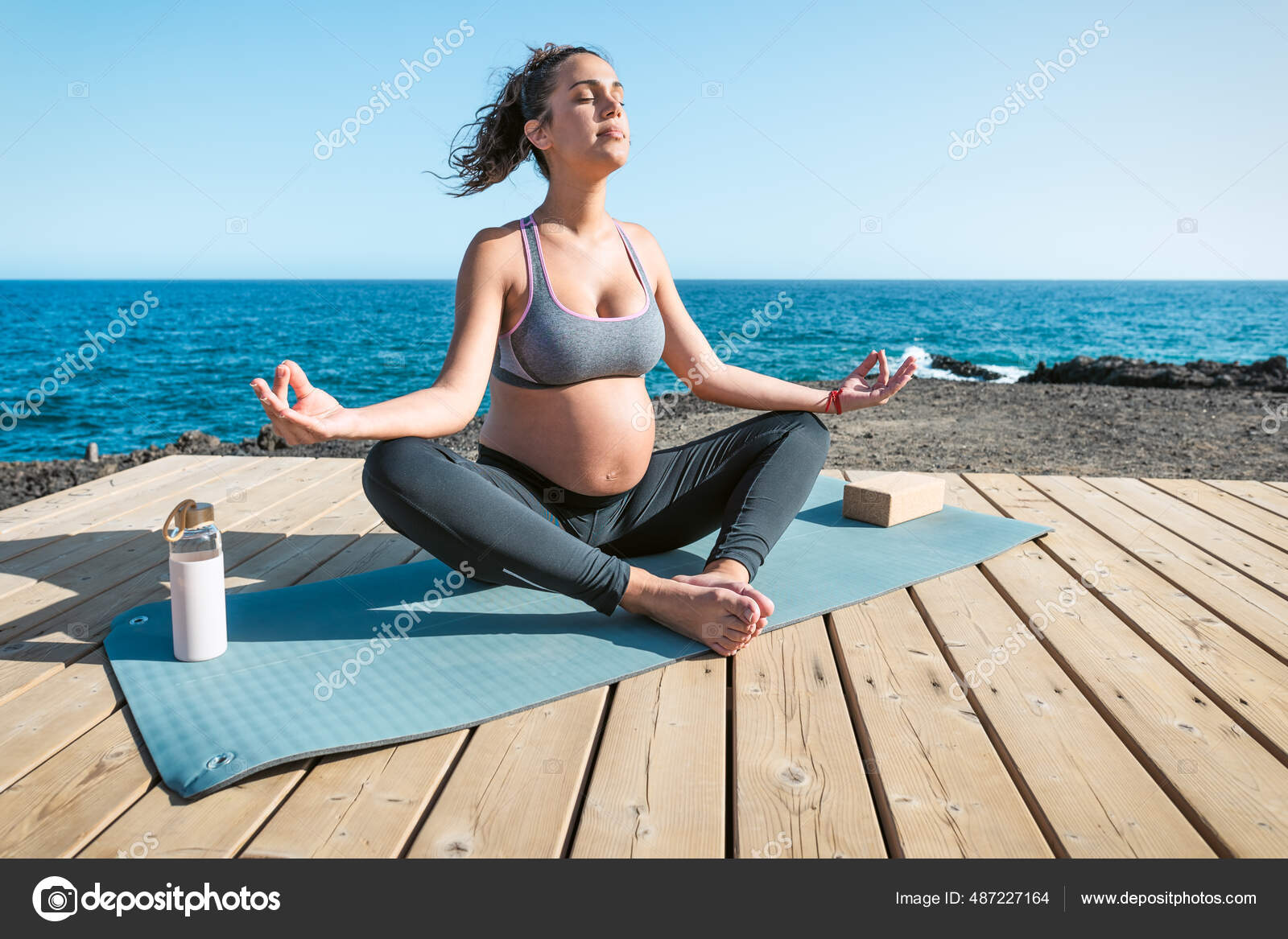 Young Pregnant Woman Doing Yoga Session Next Sea Meditation