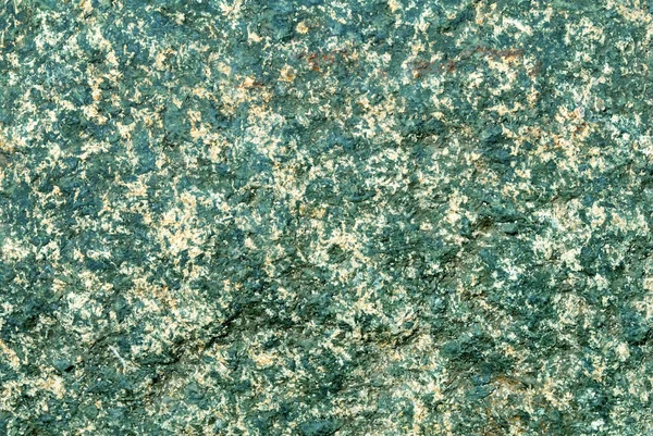Heldere close-up zandsteen textuur in groene en gele kleuren. — Stockfoto