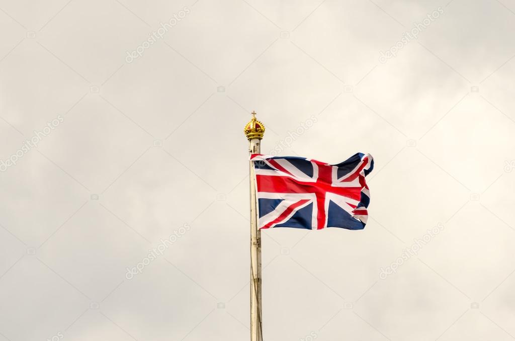 Union Jack Flag flying on a cloudy day