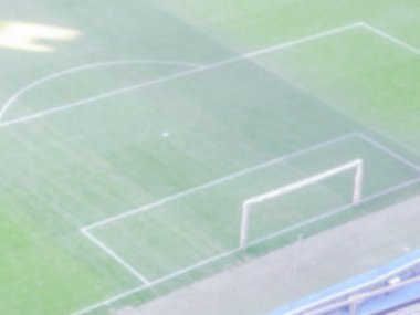 Ufuk arka planını bir futbol stadyumu.