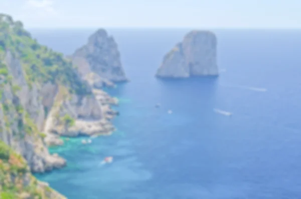 Fondo desenfocado de las rocas Faraglioni, isla de Capri —  Fotos de Stock