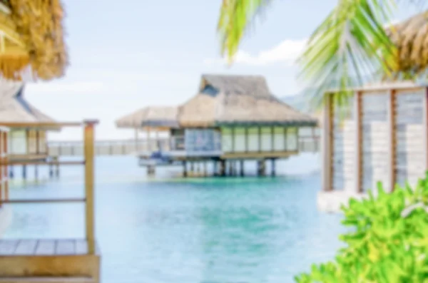 Niewyraźne tło z bungalowami w francuski Polynesi — Zdjęcie stockowe