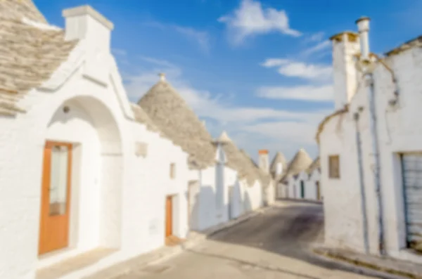 Defokussierter Hintergrund mit typischen Trulli-Gebäuden, alberobello — Stockfoto