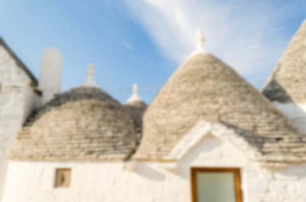 Defokussierter Hintergrund mit typischen Trulli-Gebäuden, alberobello — Stockfoto