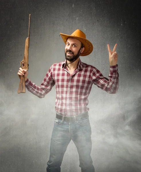 Homem com arma de brinquedo — Fotografia de Stock