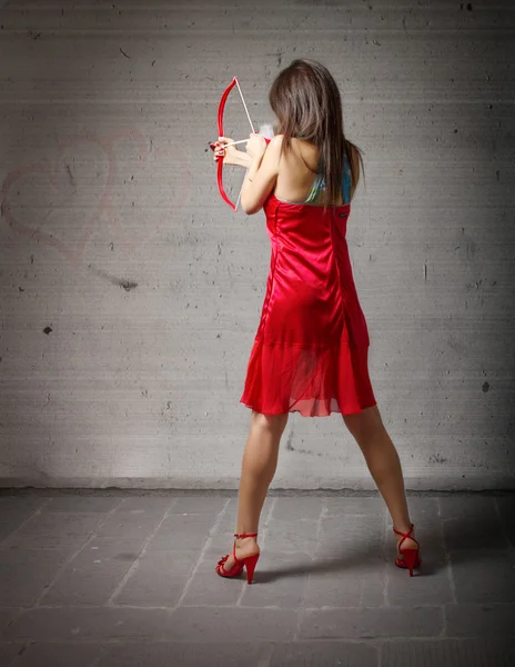 Girl in love with cupid arrow and bow — Stock Photo, Image