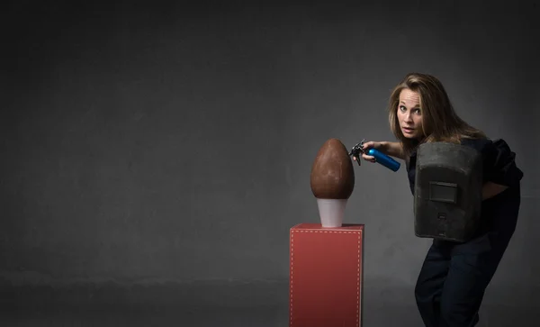 Welder and chocolate egg — Stock Photo, Image