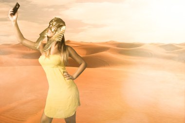 Woman in Egyptian sphinx mask take selfie clipart
