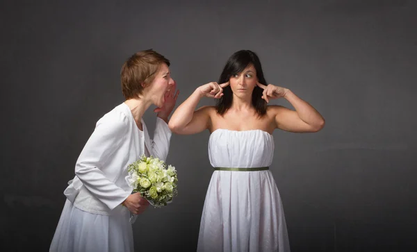 Bride scream on friends ears — Stock Photo, Image