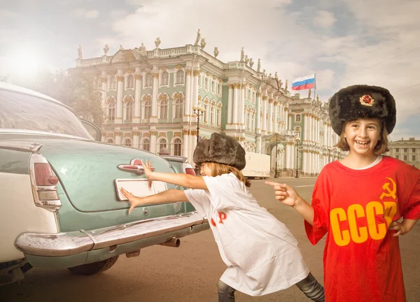 children pushing car in russian hermitage