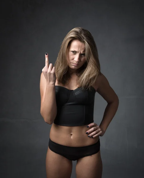 Girl showing rude gestures — Stock Photo, Image