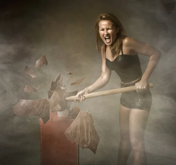 Woman destroying easter egg — Stock Photo, Image