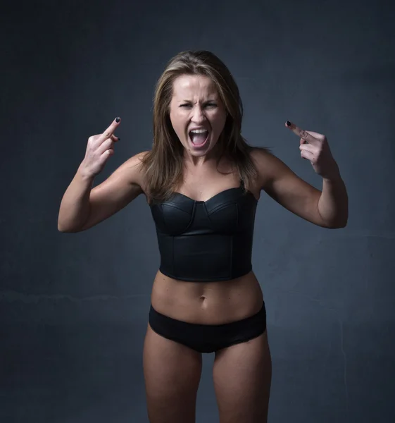 Girl showing rude gestures — Stock Photo, Image