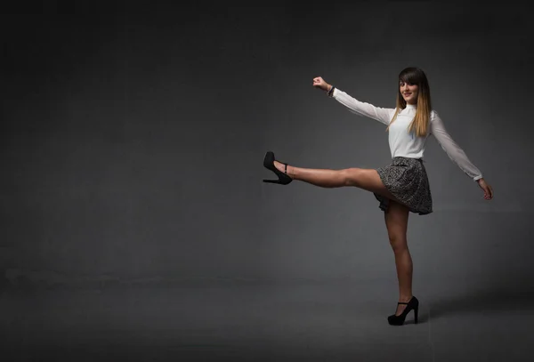 Nice girl moving legs like majorette — Stock Photo, Image