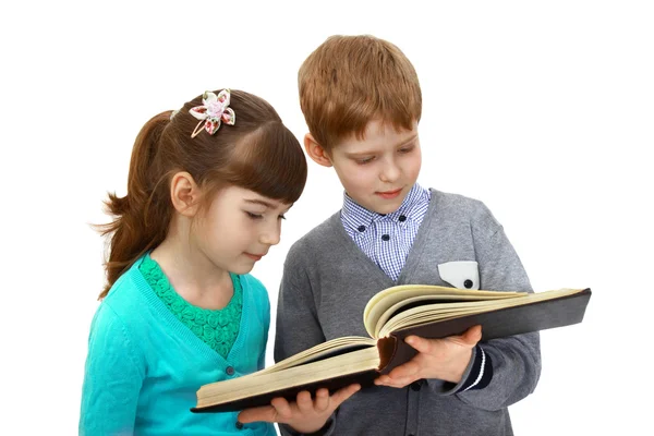 Niño y niña con libro Imagen de archivo