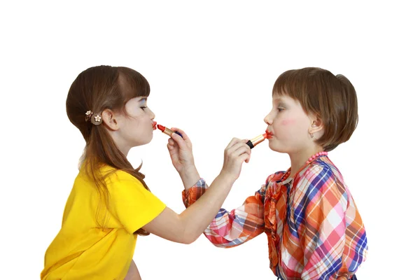 Girls color each other lipstick — Stock Photo, Image