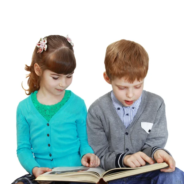 Niño y niña con libro Fotos de stock libres de derechos