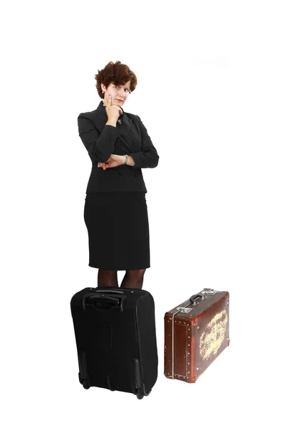 Young woman stays behind modern and vintage suitcases — Stock Photo, Image