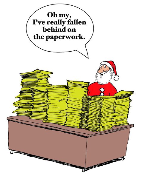Santa Claus behind piles and piles of wish lists