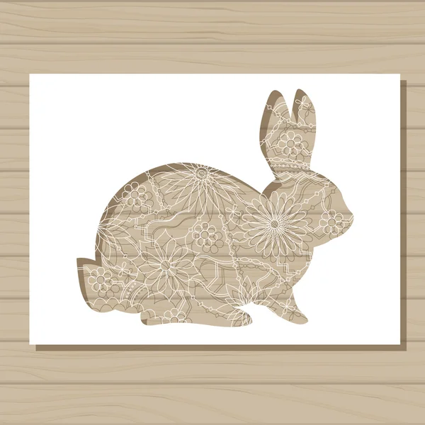 Трафарет шаблон кролика на деревянном фоне — стоковый вектор