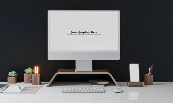 Yaratıcı modern iş yeri. Beyaz masa ve karanlık arka planda bilgisayar maketi var. Grafikler için boş beyaz ekran monitörü.