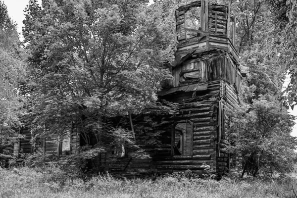 Destroyed old wooden church in the forest