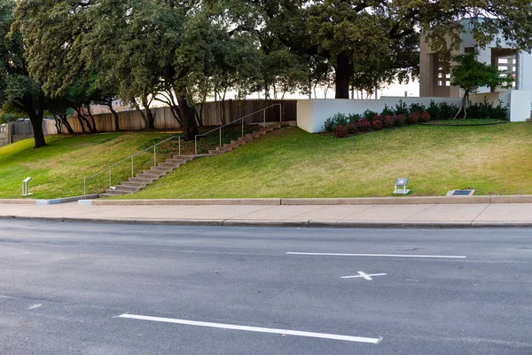 Elm Street, grassy knoll and picket fence at edge of Dealey Plaza, Dallas, Texas