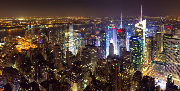 High view over Midtown West Manhattan towards Hudson River at night, New York City.