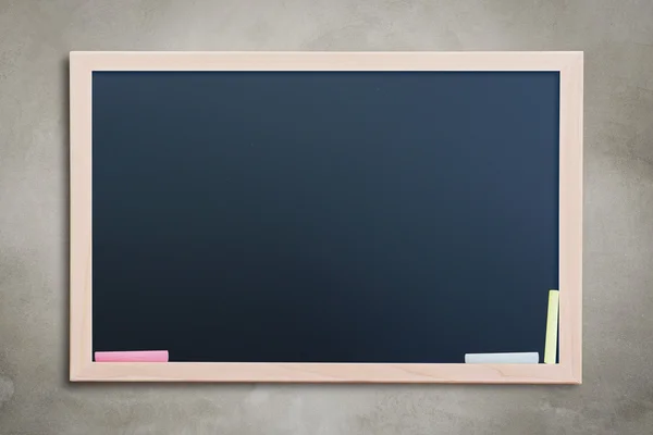 Blank chalkboard on wall — Stock Photo, Image