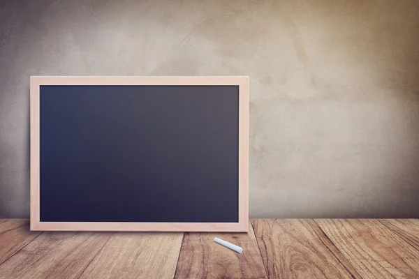 Blank chalkboard on wall — Stock Photo, Image