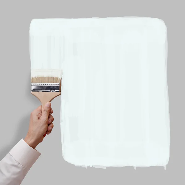Peindre la couleur blanche sur le mur gris — Photo