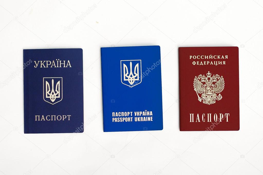 an image of Ukrainian and Russian passports on a the white background