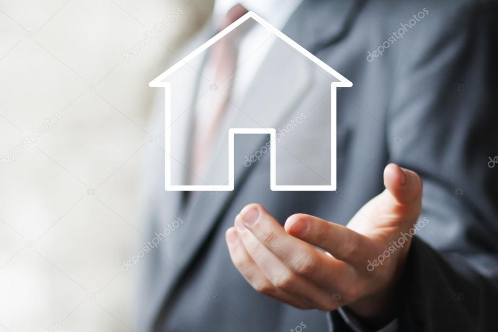 Man with touchscreen house icon