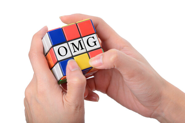 hand playing Square puzzle to be OMG the well known expression o