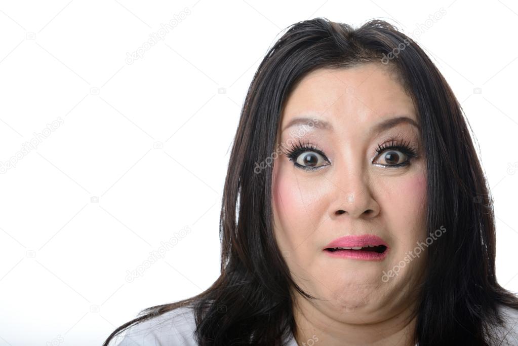Closeup portrait of frightened and shocked asian woman isolated 