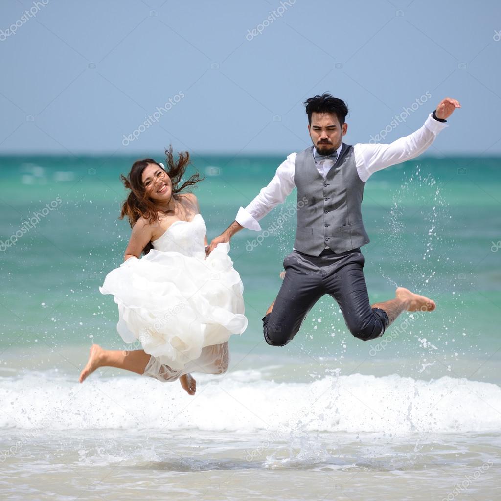 happy just married young couple celebrating and have fun at beau