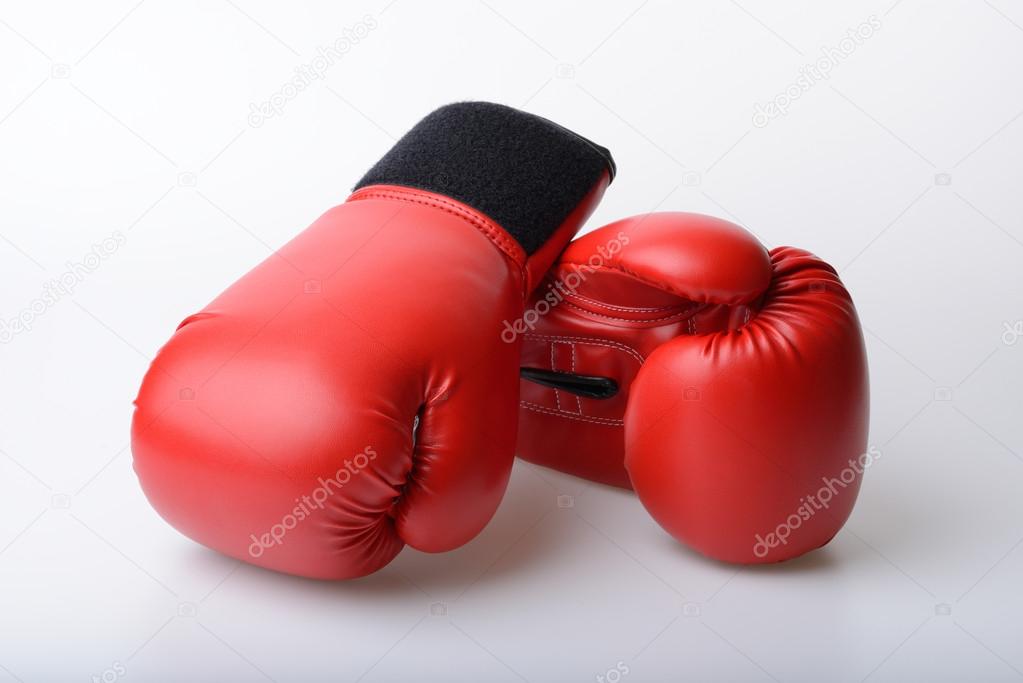 Pair of red leather boxing gloves isolated on white